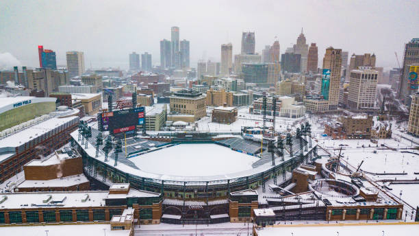 An aerial view of the skyline of the city of Detroit, MI in winter while snowing including Comerica Park An aerial view of the city skyline of Detroit, Michigan on Christmas Day 2020 while it snows including Comerica Park comerica park photos stock pictures, royalty-free photos & images