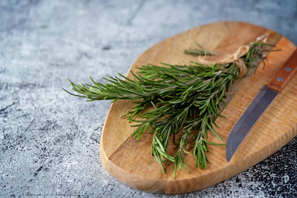 istock Raw fresh rosemary leaves on a background 1293079581