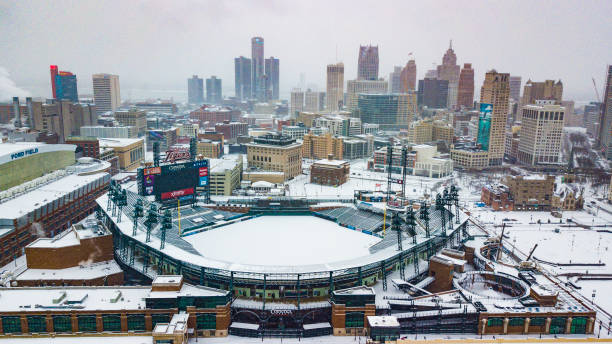 An aerial view of the skyline of the city of Detroit, MI in winter while snowing including Comerica Park An aerial view of the city skyline of Detroit, Michigan on Christmas Day 2020 while it snows including Comerica Park comerica park photos stock pictures, royalty-free photos & images