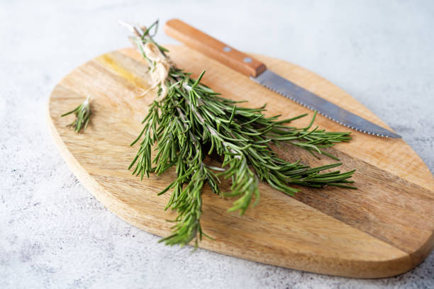 istock Raw fresh rosemary leaves on a background 1293080194