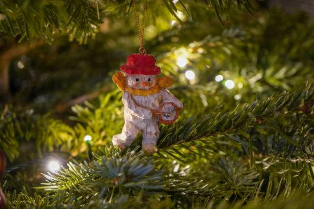 istock Small Christmas tree ornament in a real Christmas tree 1293080289