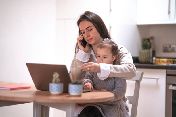 istock Young mother working at home with her daughter 1293082335