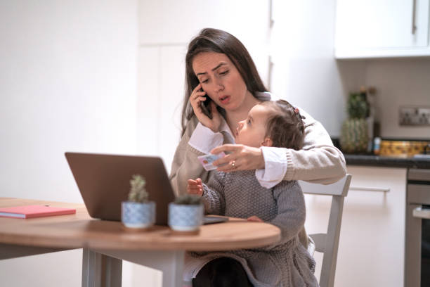 istock Young mother working at home with her daughter 1293082364