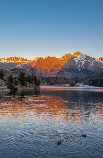 St. Moritz, Switzerland - November 26, 2020: Sunset at the swiss Lake St.Moritz in canton Graubunden