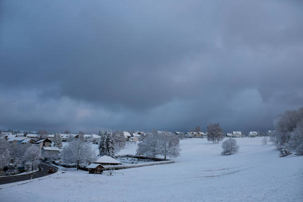 istock snow-covered village and cloudy sky 1293091048