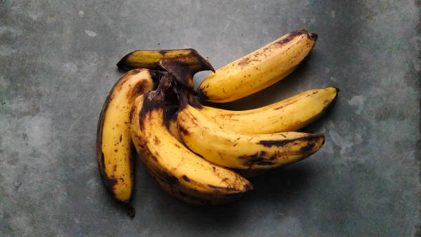 istock Flat Lay Bananas on Concrete Floor 1293092482
