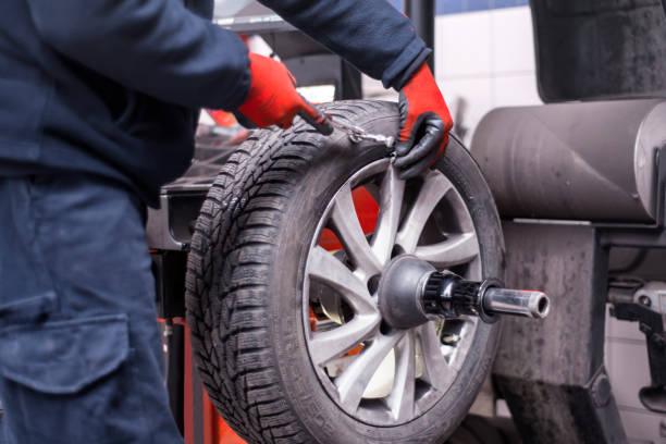 istock An unrecognizable tire repairman using wheel balancing machine 1293092780