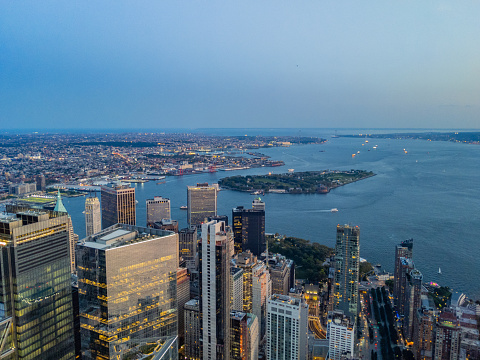 Aerial view of Financial District, Governors Island, and Brooklyn before sunset, view from One World Trade Center facing south