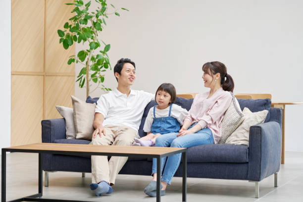 istock Asian family talking at home 1293109011