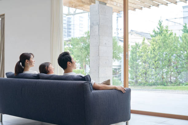 istock Asian family talking at home 1293109556