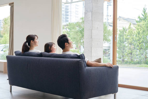 istock Asian family talking at home 1293109575