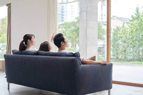 istock Asian family talking at home 1293109582