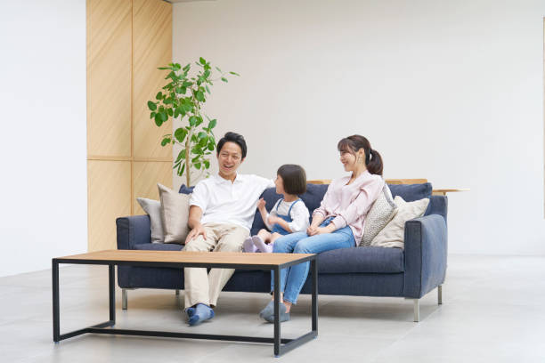 istock Asian family talking at home 1293109584