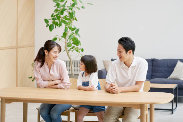 istock Asian family talking at home 1293109588