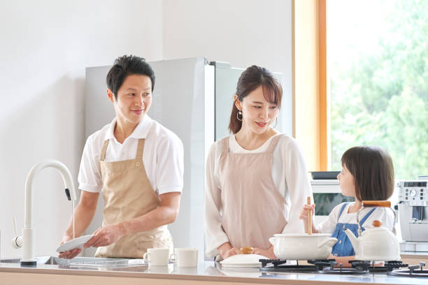 istock Asian family cooking at home 1293109612