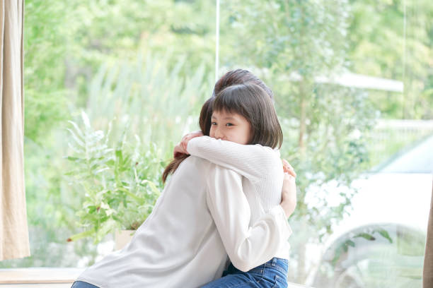 istock Asian mother hugging her daughter 1293109773