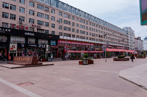 China, Heihe, July 2019: Central shopping pedestrian street by day in Heihe city in summer