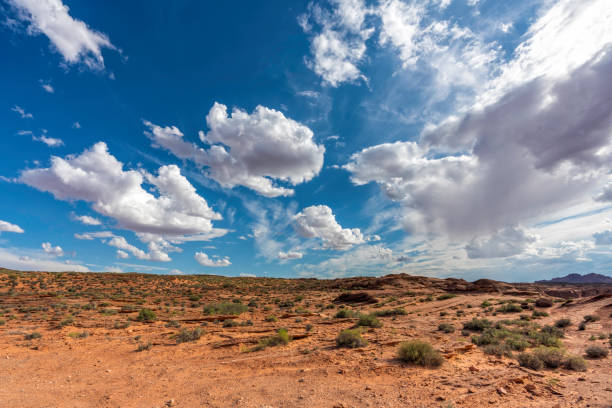Desert landscape and blue sky with puffy clouds, Utah