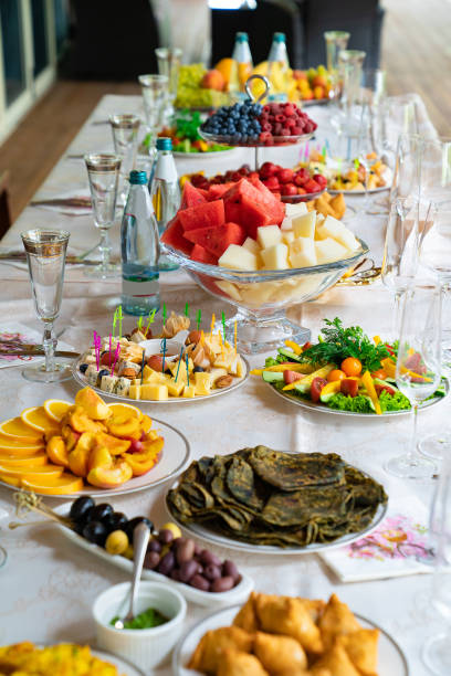 istock table served with light summer snacks-fruits, vegetables, berries. catering 1293121758
