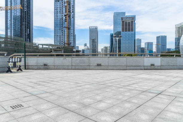 istock Empty brick floor with city skyline background 1293125386