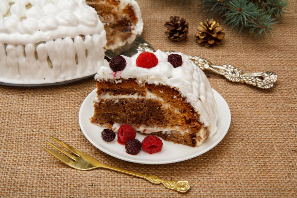 istock Sliced biscuit cake decorated with whipped cream and raspberries 1293126062