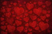 Grunge red background with heart shapes