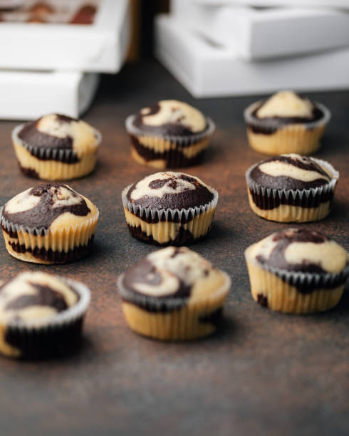 Homemade marble chocolate vanilla cupcakes. Delicious dessert. Selective focus stock photo