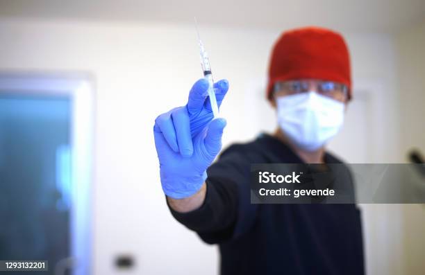 Doctor Preparing Injection Stock Photo - Download Image Now - Vaccination, Dentist, Food and Drug Administration