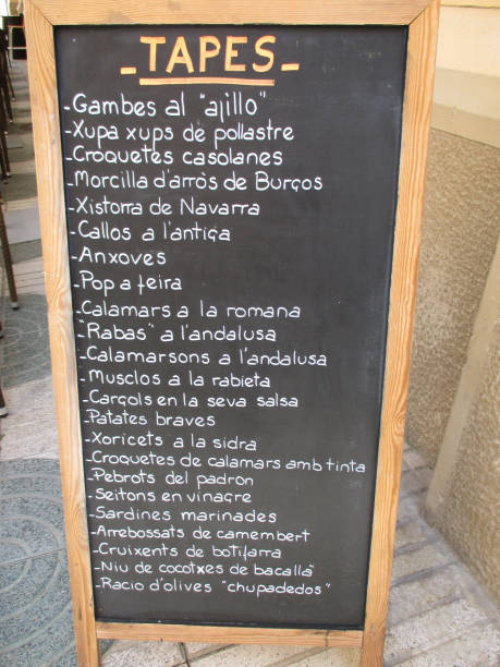 istock Tapas Menu  Chalkboard Placed on a Restaurant Outdoor Terrace  Spanish gastronomy 1293132876