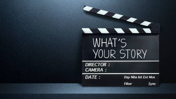 what's your story text title on film slate.black and blue abstract cement wall in studio room. - storey imagens e fotografias de stock