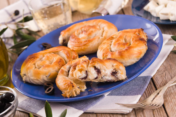istock Pastry swirls with cheese and olive filling. 1293136211