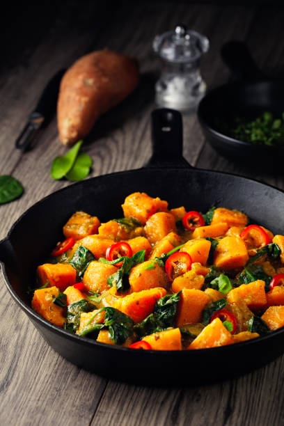 istock Healthy Vegan sweet potato spinach Thai curry 1293140247