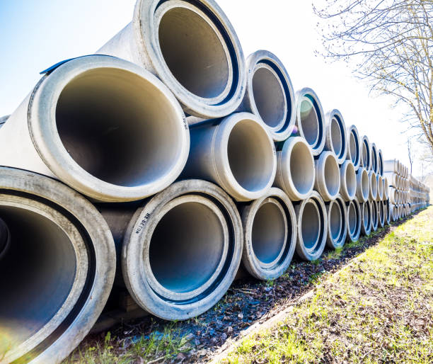 istock Long rows with new reinforced concrete pipes in wide-angle optics 1293140834