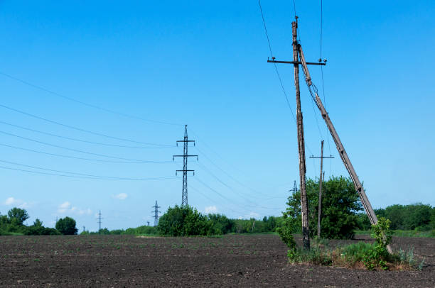 istock old power line over plowed field 1293142796