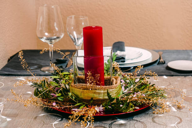 istock Centerpiece with red candle and branches. Christmas decoration 1293145947