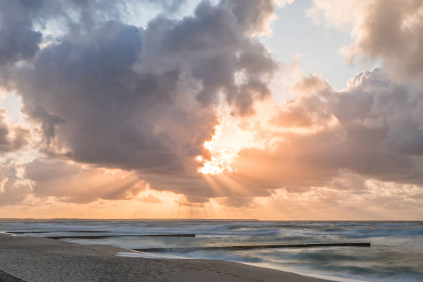 istock Golden sunset with dramatic cloudscape over the sea. 1293147377