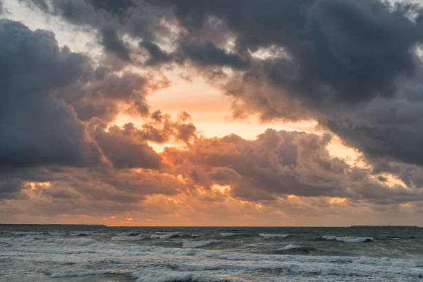 istock Golden sunset with dramatic cloudscape over the sea. 1293147885