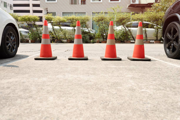 istock Four old traffic cones on the road surface 1293148089