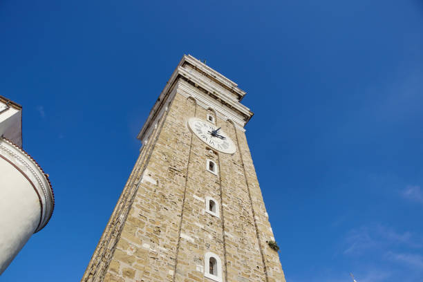istock The clock tower with blue sky in italy . Medieval tower 1293148288