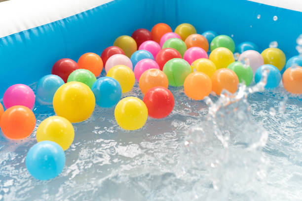 istock Colored plastic balls in the inflatable pool for fun. 1293149130