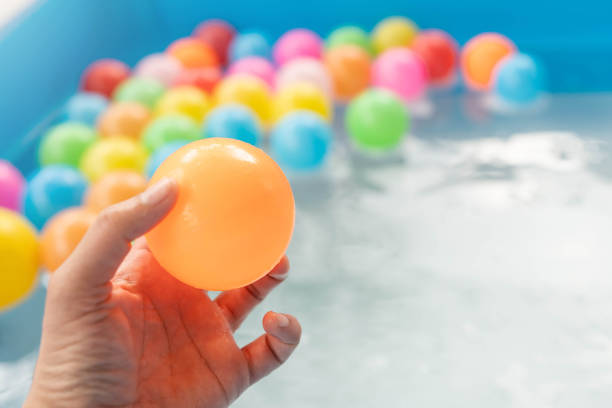 istock Colored plastic balls in the inflatable pool for fun. 1293149175