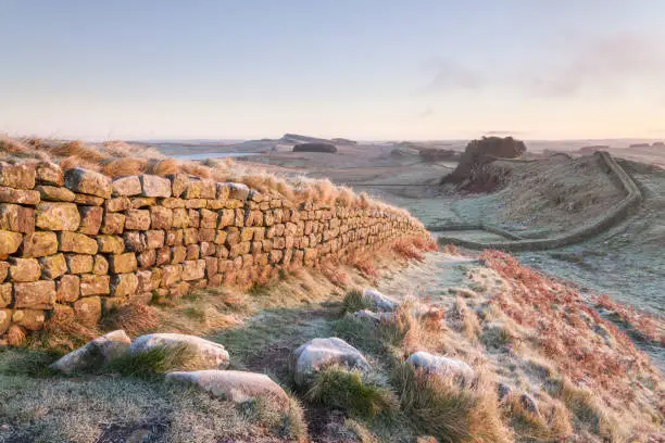 Hadrians Wall near Housesteads on a cold and frosty morning in winter time in Northumberland