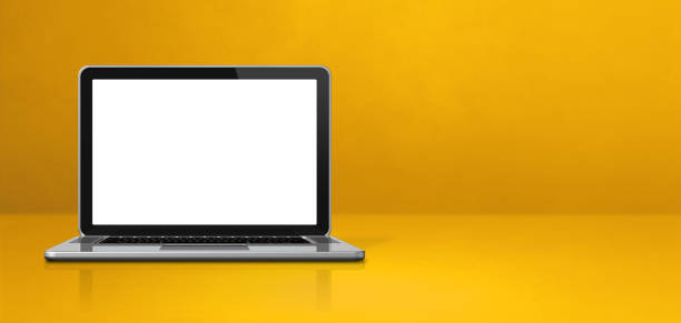 istock Laptop computer on yellow office scene background banner 1293160484