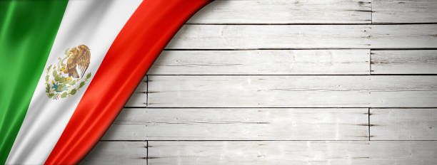 istock Mexican flag on old white wall banner 1293160504