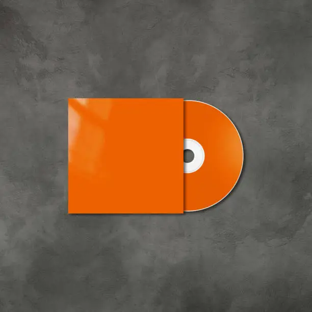 Orange CD - DVD label and cover mockup template isolated on concrete background