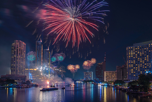 firework celebration in Bangkok city skyline with Twilight night and firework lighting in bangkok cityscape background, Thailand.