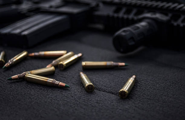 istock Cluse-up Sig Sauer SIG 516 with 5.56 m855 62gr green tip ammunition 1293161021