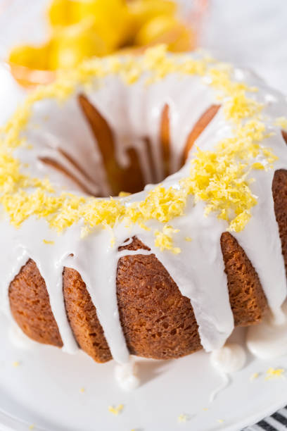 istock Lemon bundt cake decorated with lemon zest on a cake stand. 1293161791