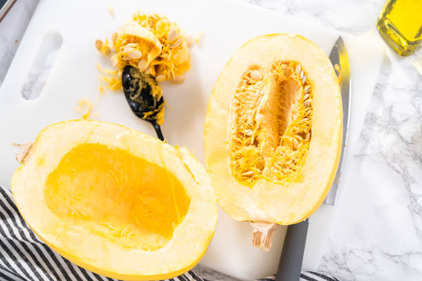 istock Preparing organic spaghetti squash with olive oil, salt, and pepper. 1293161816