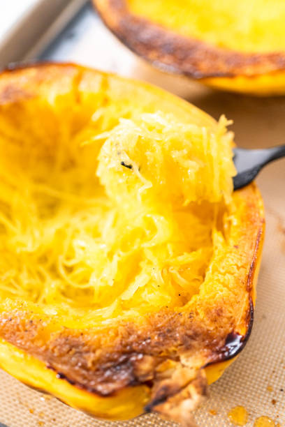 istock Preparing organic spaghetti squash with olive oil, salt, and pepper. 1293161992